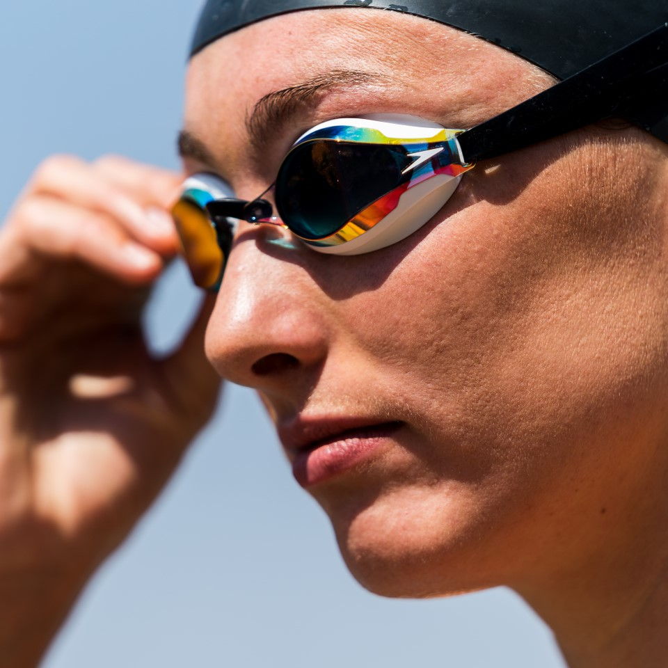 Woman wearing Speedo swimming goggles and swimming caps